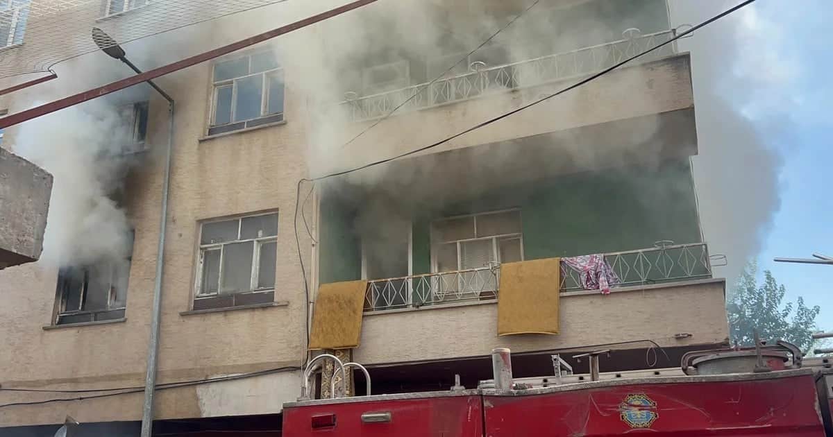 Bismil'de yangında mahsur kalan kadını konteynerin üzerine çıkan 2 kişi kurtardı