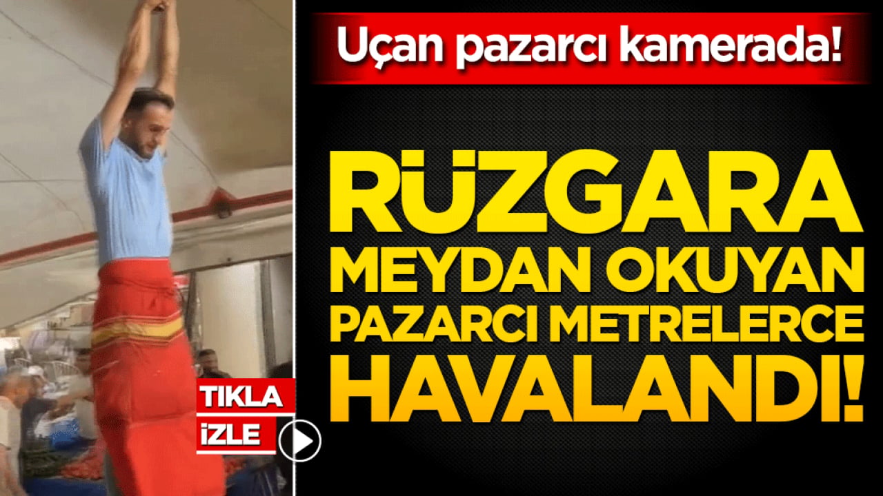 Rüzgara meydan okuyan pazarcı metrelerce havalandı! Uçan pazarcı kamerada!