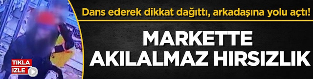 Dans ederek dikkat dağıttı, arkadaşına yolu a&ccedil;tı! Markette akılalmaz hırsızlık