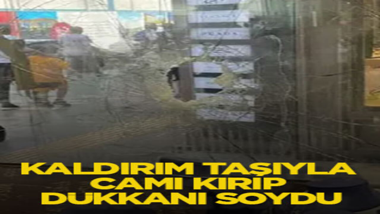 Kaldırım taşıyla camı kırıp dükkanı soydu