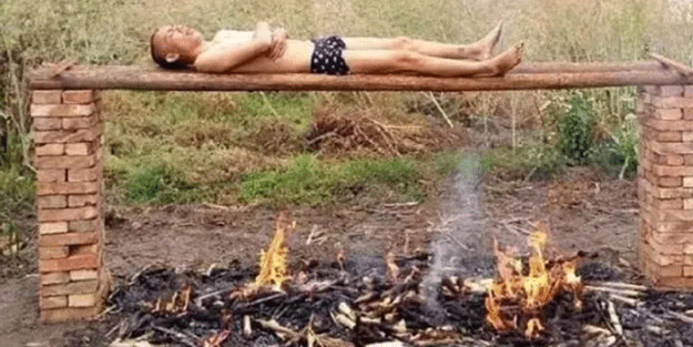 Ateşin üzerinde yatıyor! Neden yaptığı ise şok etti