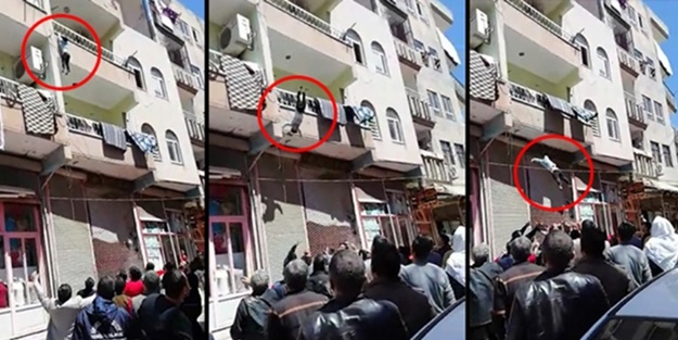 Balkondan düşen çocuğu havada yakaladılar!