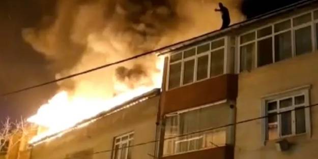 Bir binada yangın çıktı, çatıya çıkan şahıs korkuttu! 