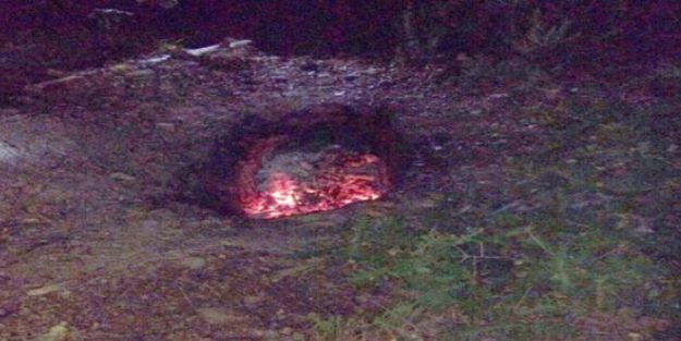 Kuyunun içinde cesedi cayır cayır yaktı