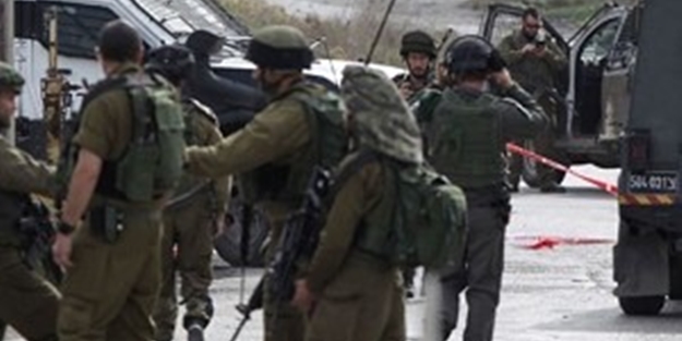 Aracı ile İsrail'li subayların arasına daldı