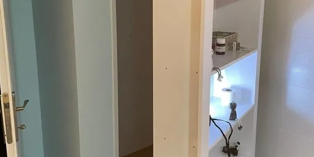 Firari FETÖ'cü kadın kitaplığın arkasındaki gizli bölmede...