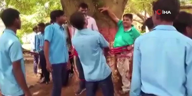 Görüntüler sosyal medyanın gündemine oturdu! Öğretmenlerini döverek ağaca bağladılar