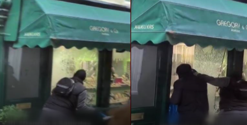 Gündüz gözüyle soygun kamerada: İnsanların gözü önünde baltayla camı kırdılar!