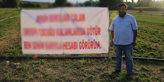 Hırsızlara bu pankartla seslendi