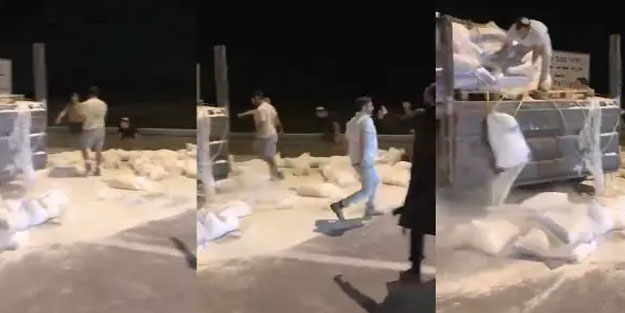 İşgalci teröristler un çuvallarını parçaladı! Alçaklık kayıt altına alındı