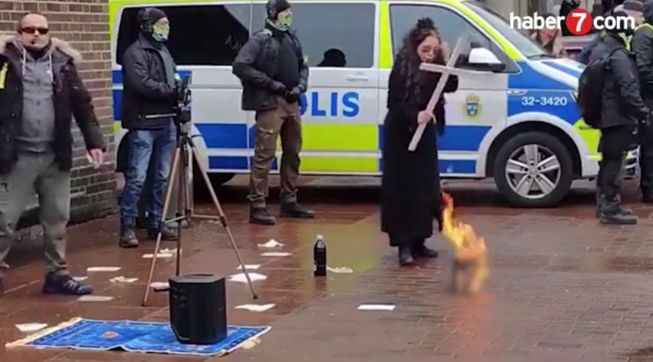İsveç’te KADIN KILIĞINA GİRMİŞ BİR ŞEYTAN polis eşliğinde Kur'an-ı Kerim yaktı