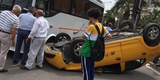 İzmir'de takla atan taksi ters döndü, sürücü yaralandı