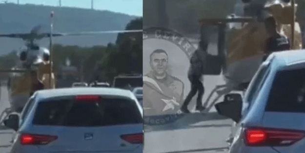 İzmir'de trafiğin ortasına inen helikopter, bir kişiyi alıp uzaklaştı
