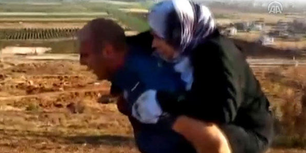Kahraman Türk polisi, yaralı Suriyeli kadını 2 kilometre sırtında taşıdı!