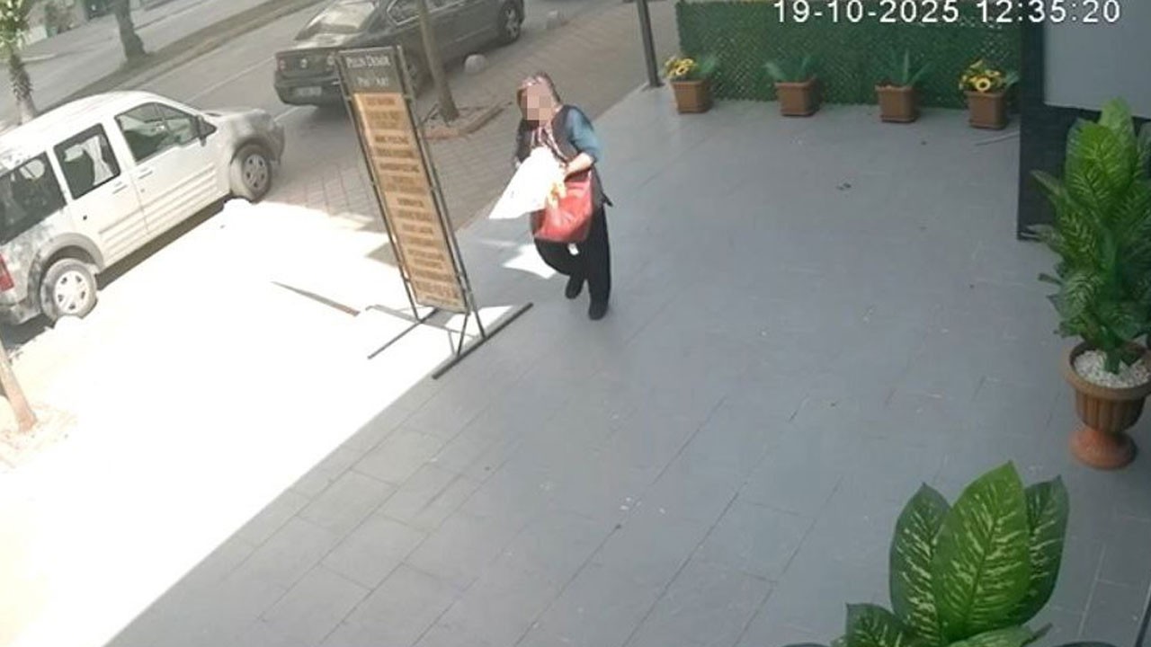 Kameraya böyle yakalandı! Yapay çiçekleri poşete doldurup kaçtı