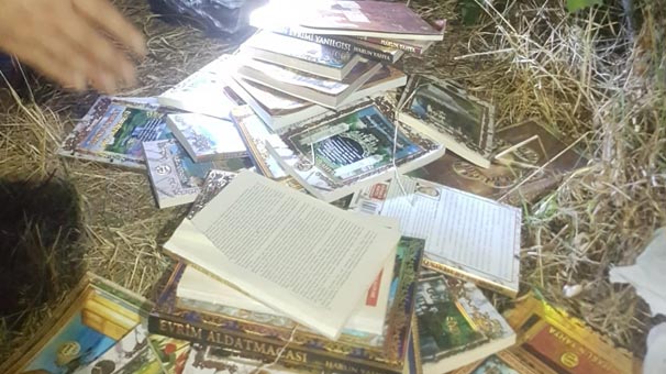 Kırşehir'de gittiği bağ evinde sokağa atılmış Adnan Oktar kitapları buldu