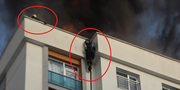 Korku dolu anlar kaydedildi! Alevlerin içinde kalan itfaiyeci 11. kattan yere çakıldı
