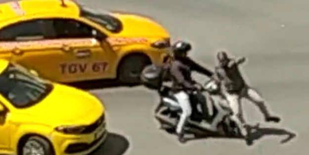 Motosiklet sürücüsü, tartıştığı taksiciyi ezmeye çalıştı
