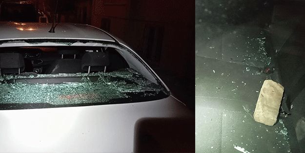 Park halindeki aracın camını kaldırım taşıyla kırdılar