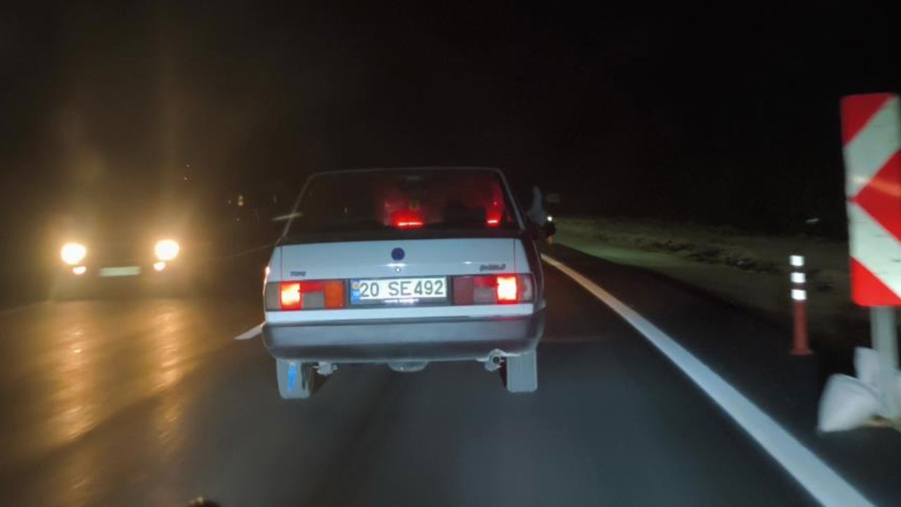 Seyir halinde ayaklarını pencereden çıkartan maganda kamerada