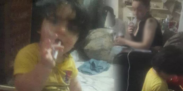 Skandal görüntüler! 2 yaşındaki oğluna sigara içirdi