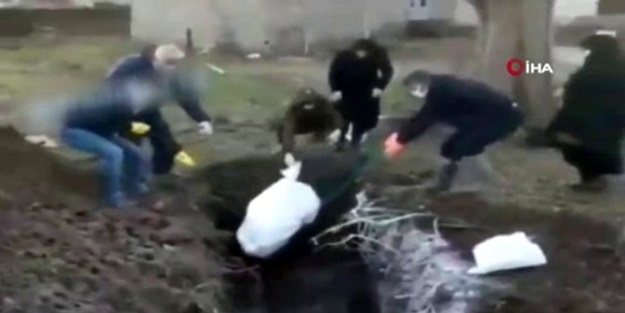 Toplu mezarlar açıldı! İran'da koronavirüsten ölenler böyle gömülüyor