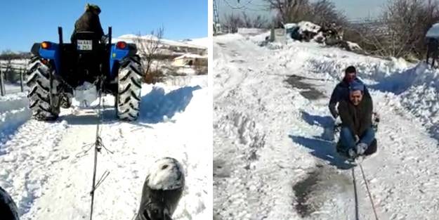 Traktör arkasında sörf keyfi! Eğlenceli anlar böyle kaydedildi