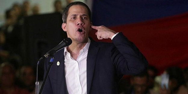 Venezuela'da muhaliflerle hükümet destekçileri arasında arbede! Juan Guaido'ya silah doğrultuldu
