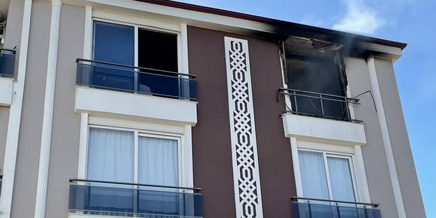 Yangında mahsur kalan iki torununu kurtardı