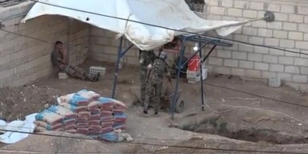 YPG'li teröristler mezarlarını kazarken görüntülendi
