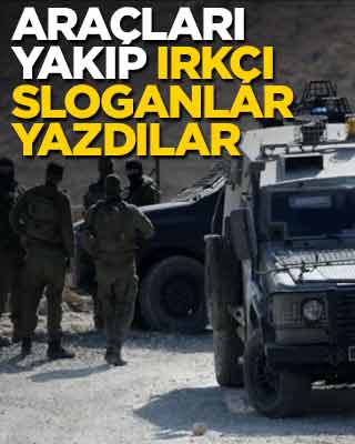 Araçları yakıp ırkçı sloganlar yazdılar