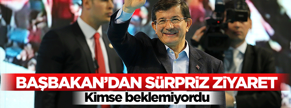 Başbakan Davutoğlu camdan kendisine el sallayan aileyi ziyaret etti
