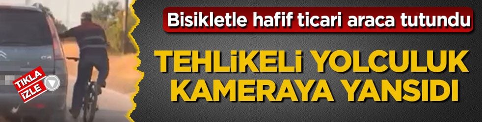 Bisikletle hafif ticari araca tutundu! Tehlikeli yolculuk kameraya yansıdı