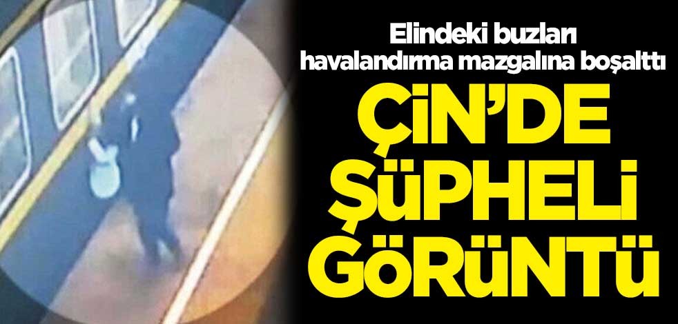 Çin'de şüpheli görüntü! Elindeki buzları havalandırma mazgalına boşalttı