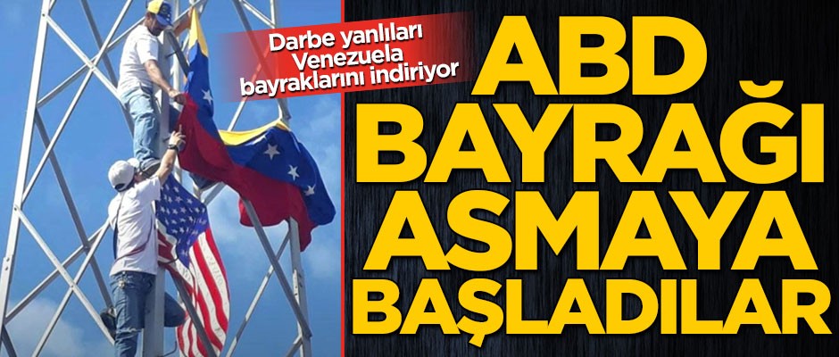 Darbe yanlıları Venezulea bayrağını indirip ABD bayrağı asıyor
