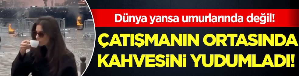 Dünya yansa umurlarında değil: Çatışmanın ortasında kahvesini yudumladı!