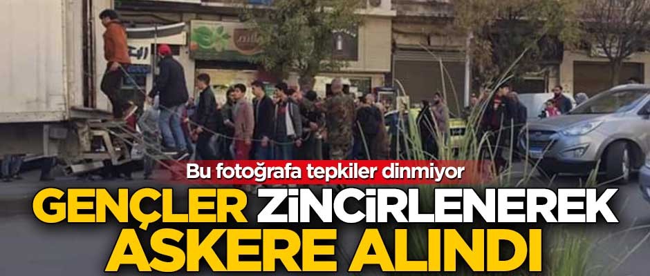 Esed rejimi, gençleri kelepçeleyerek askere aldı!
