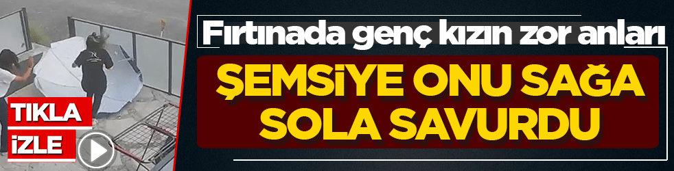 Fırtınada genç kızın zor anları: Şemsiye onu sağa sola savurdu