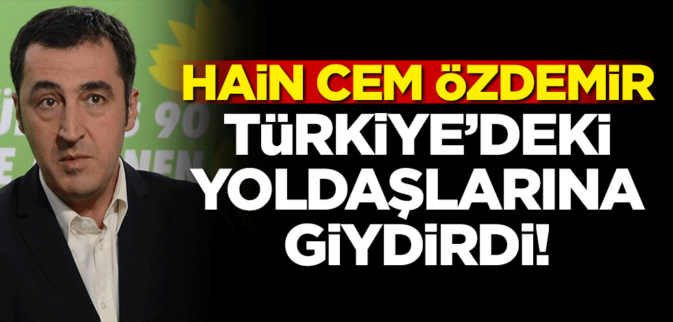 Hain Cem Özdemir Türkiye'deki yoldaşlarına giydirdi