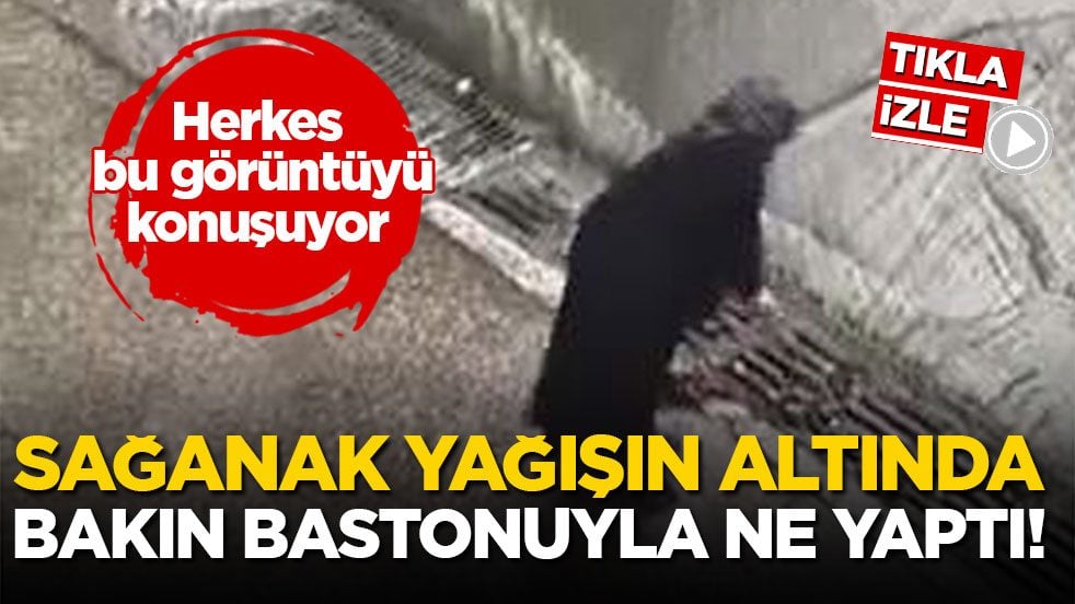 Herkes bu görüntüyü konuşuyor... Sağanak yağışın altında bakın bastonuyla ne yaptı!
