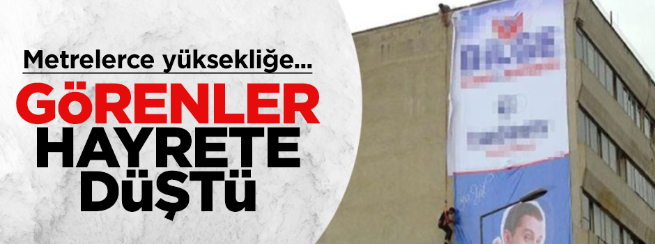 Metrelerce yüksekliğe iple asılarak afiş astı