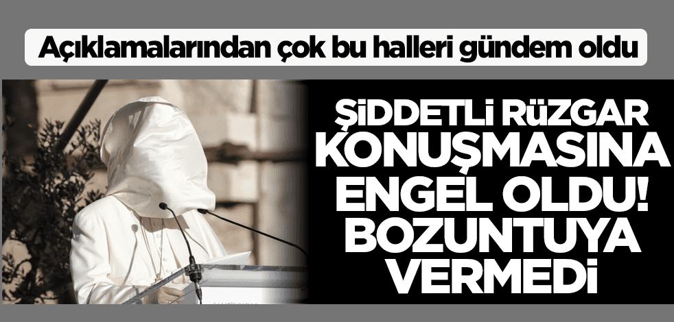 Şiddetli rüzgar konuşmasına engel oldu! Bozuntuya vermedi