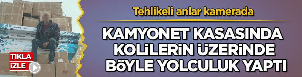 Tehlikeli anlar kamerada! Kamyonet kasasında kolilerin üzerinde böyle yolculuk yaptı