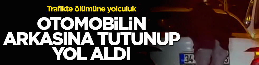 Trafikte ölümüne yolculuk: Hareket halindeki aracın arkasına tutunup metrelerce ilerledi
