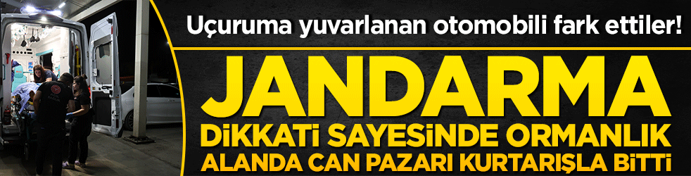 Uçuruma yuvarlanan otomobili fark ettiler! Jandarma dikkati sayesinde ormanlık alanda can pazarı!